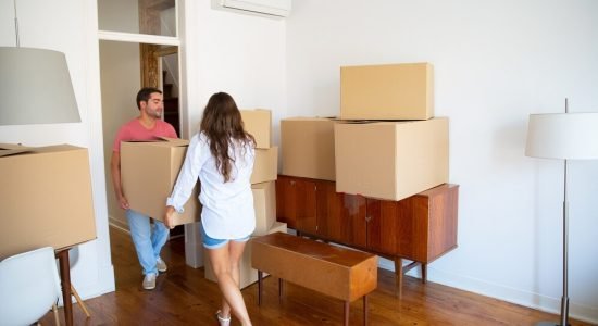 family-couple-leaving-their-apartment-carrying-carton-boxes-furniture_74855-9878